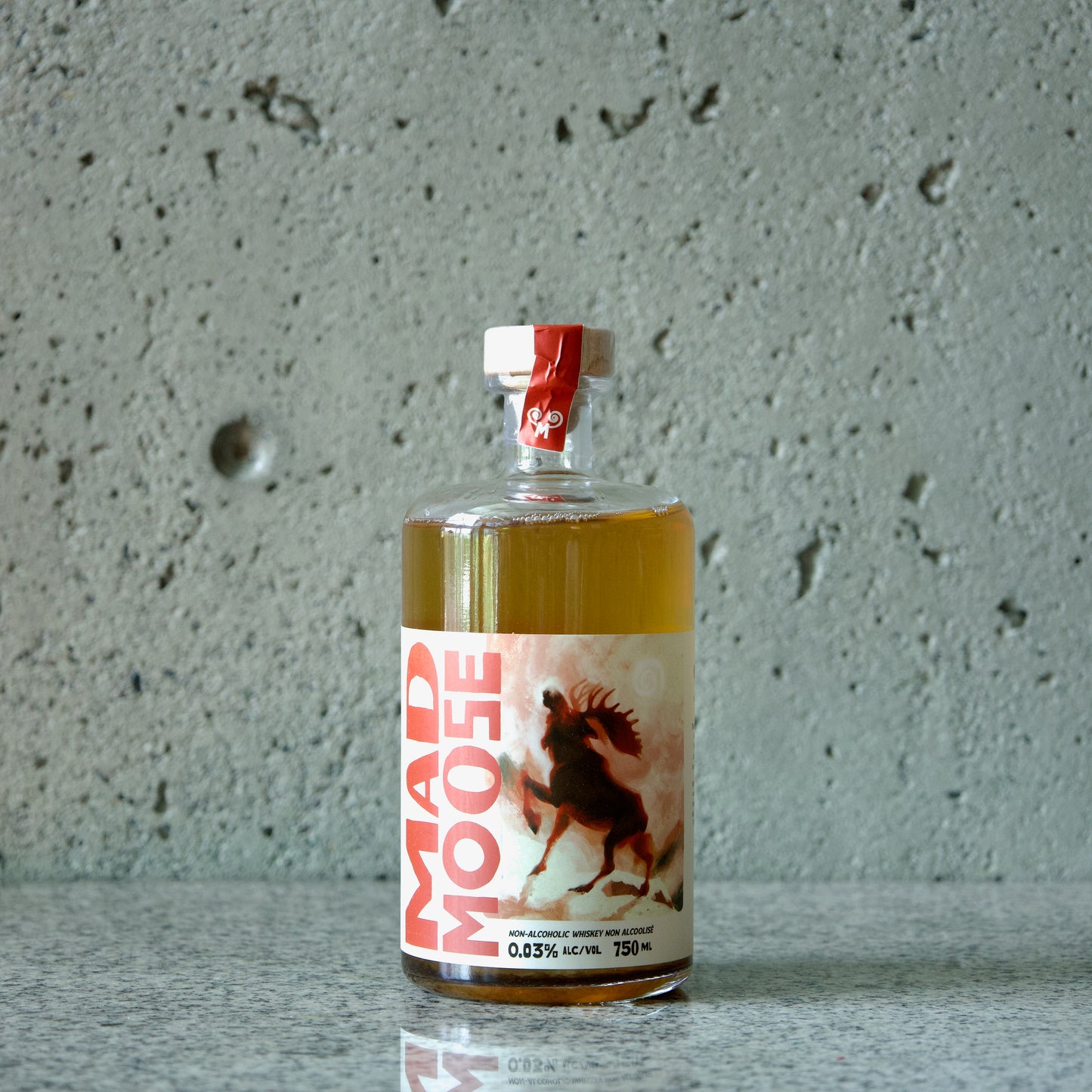 Label side of bottle of Mad Moose non-alcoholic whiskey