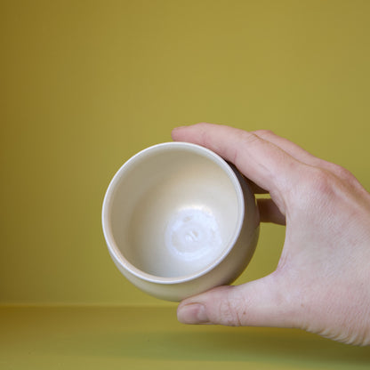 Cream Round Cup by Dustin Ryan Yu