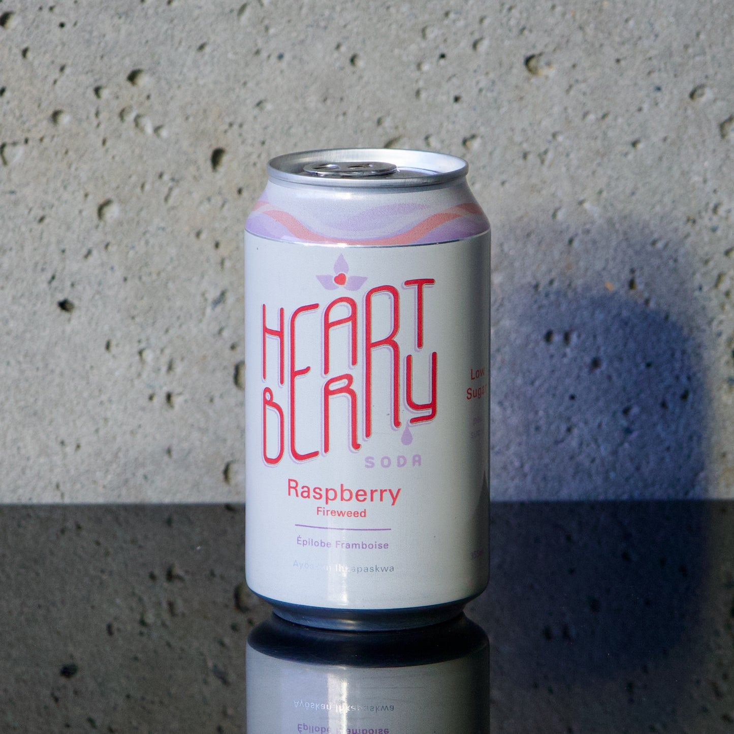 Heartberry Raspberry and Fireweed Soda can in soft light